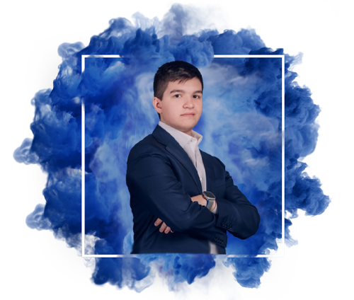 A man in a blue shirt with a happy expression